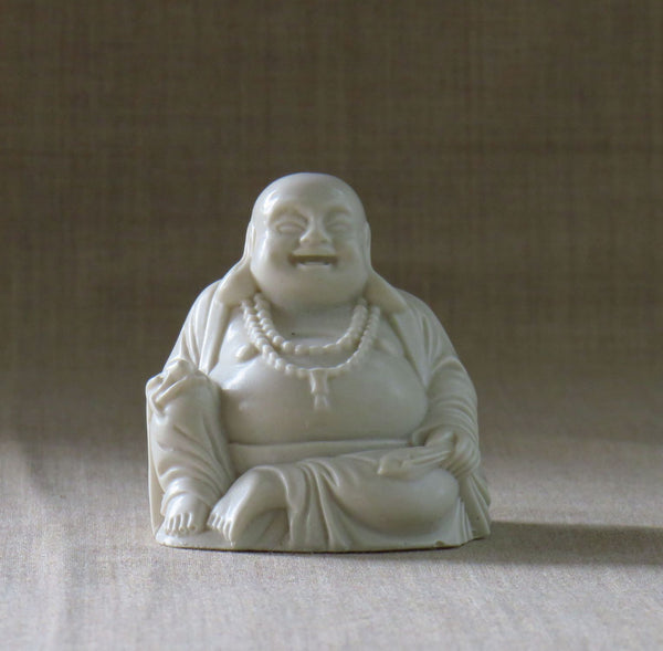 Fat bellied Lucky Buddha with a Bat