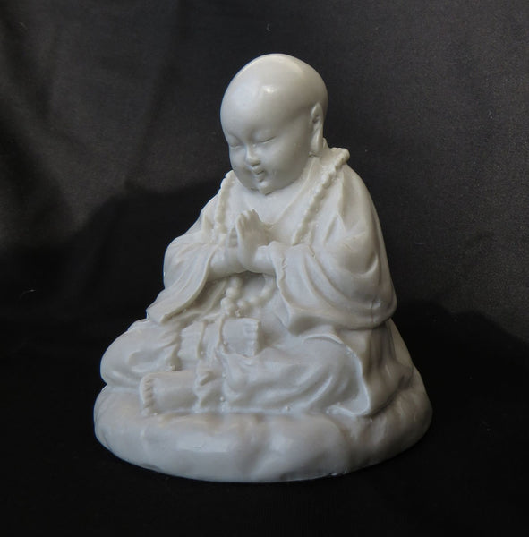 Young Tibetan style, Praying Buddha in reconstituted marble.