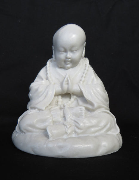 Young Tibetan style, Praying Buddha in reconstituted marble.