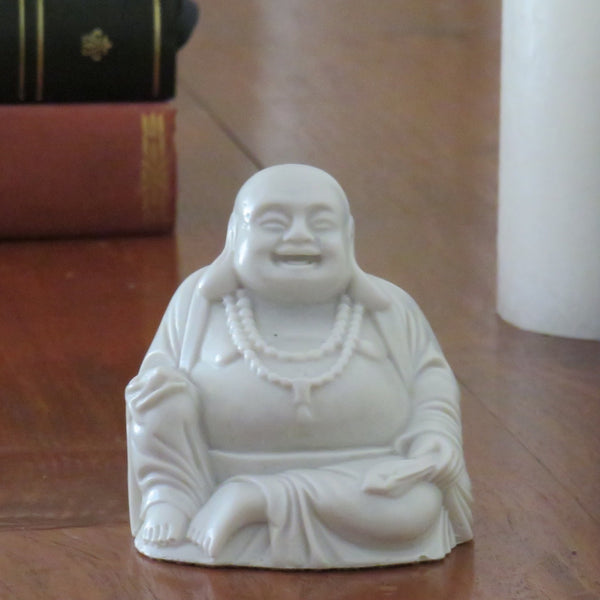 Fat bellied Lucky Buddha with a Bat